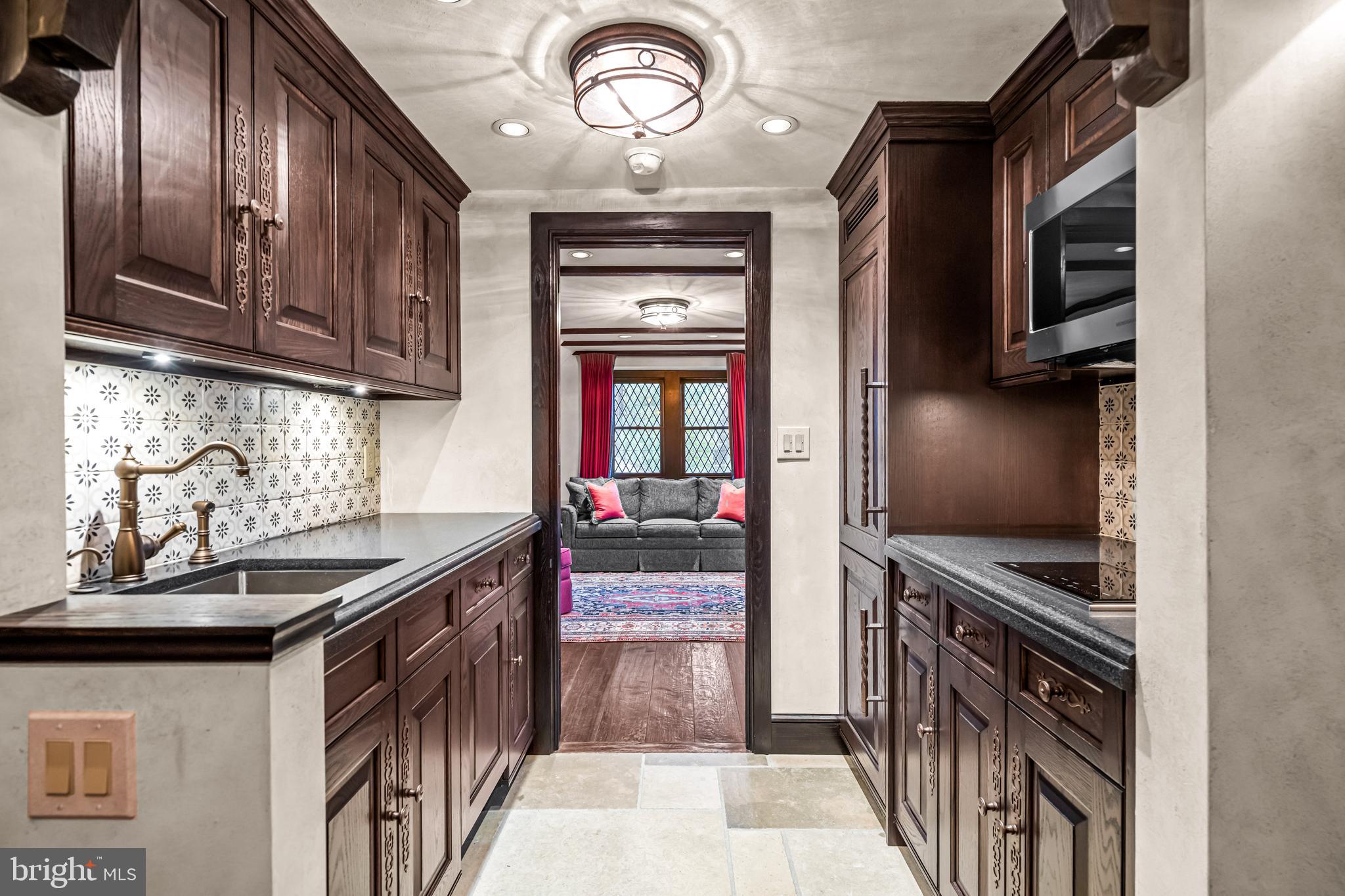 56 Crosby Brown Road Gladwyne, PA 19035 - Photo 42 of 51 a kitchen with stainless steel appliances granite countertop a stove and a refrigerator