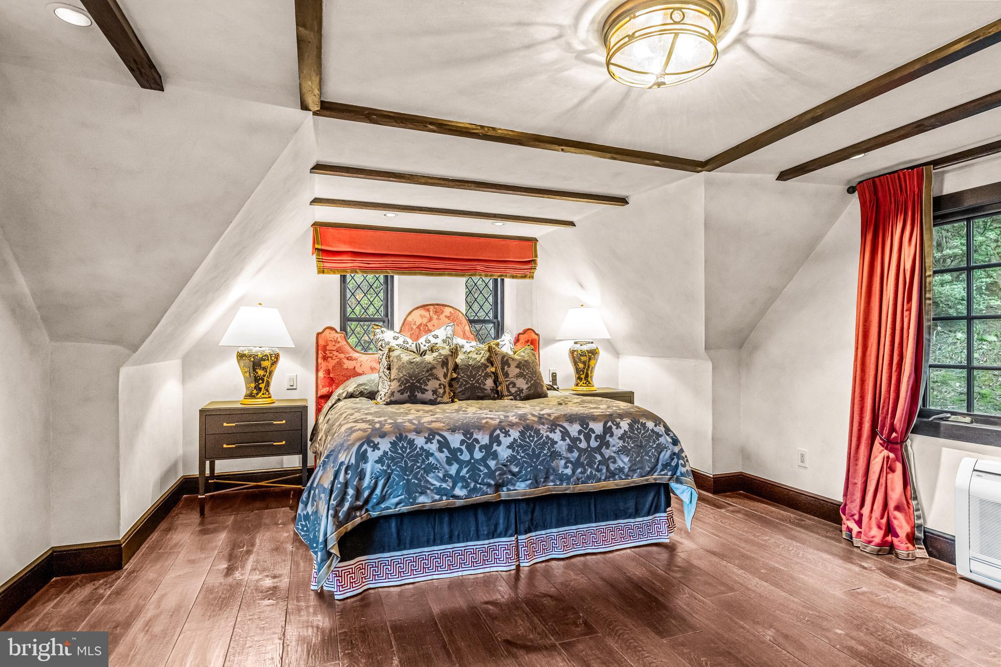 56 Crosby Brown Road Gladwyne, PA 19035 - Photo 45 of 51 a bedroom with a bed and wooden floor