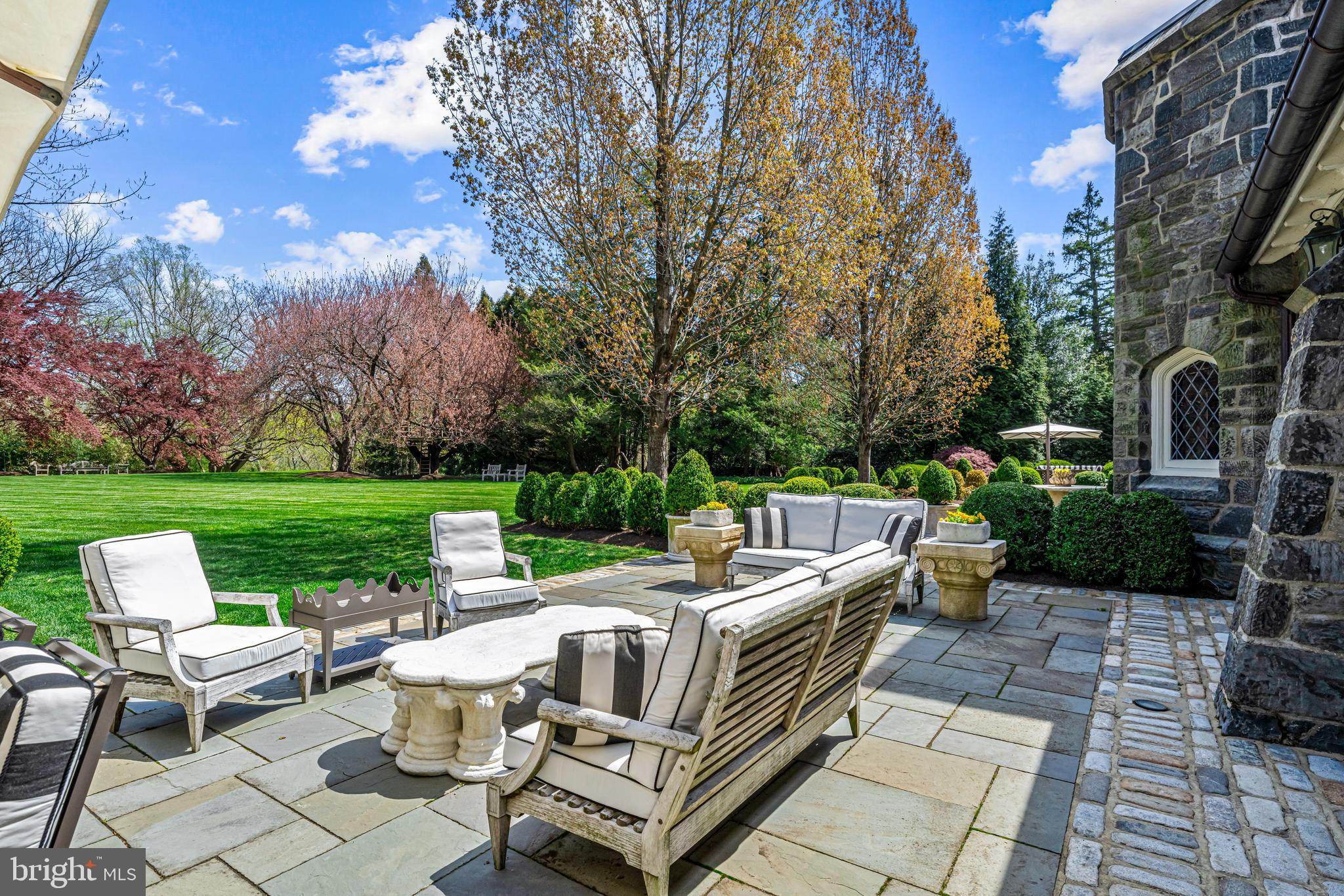 56 Crosby Brown Road Gladwyne, PA 19035 - Photo 47 of 51 a view of a patio with couches chairs and a yard