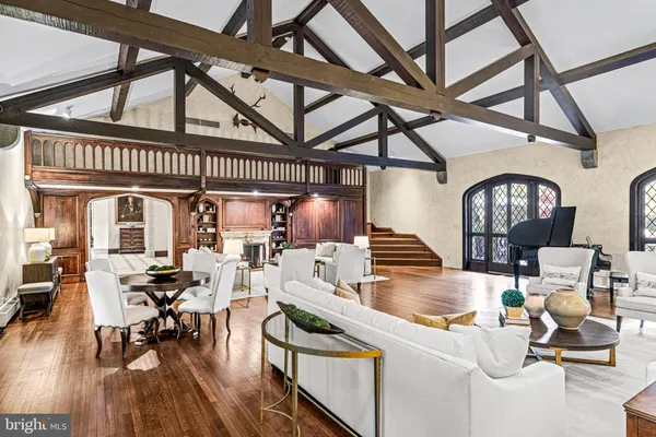 a view of a livingroom with furniture and a large window