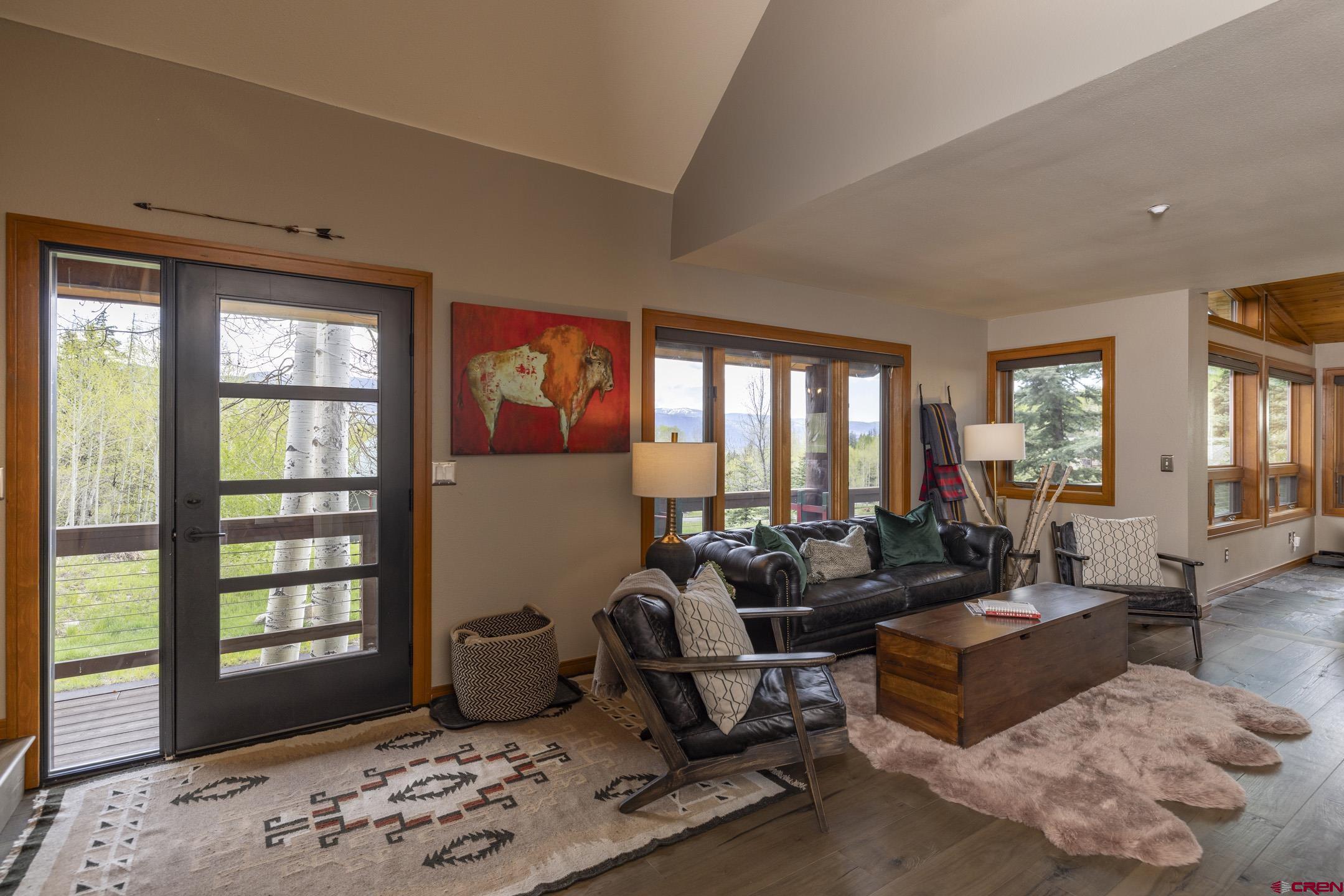 154 Falcon Ridge Road Durango, CO 81301 - Photo 9 of 42 a living room with furniture and large windows