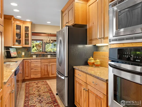 a kitchen with a refrigerator and a sink