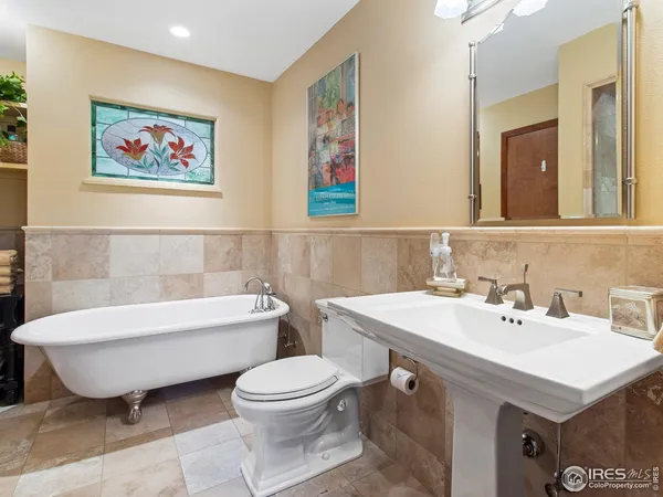 a bathroom with a toilet a sink and a bathtub