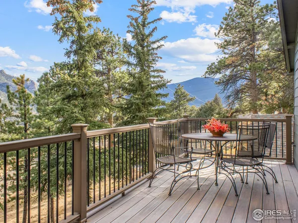 a view of balcony with wooden floor and outdoor seating