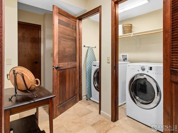 a view of a bathroom with a sink and a washer dryer