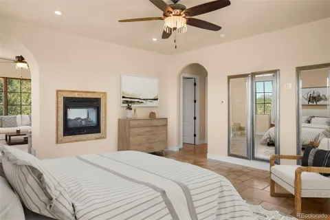 a bedroom with a bed and a couch