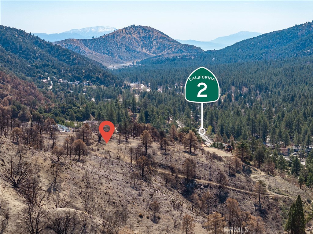 0 North Cardinal Road Wrightwood, CA 92397 - Photo 14 of 22 a view of a house with a backyard and a forest