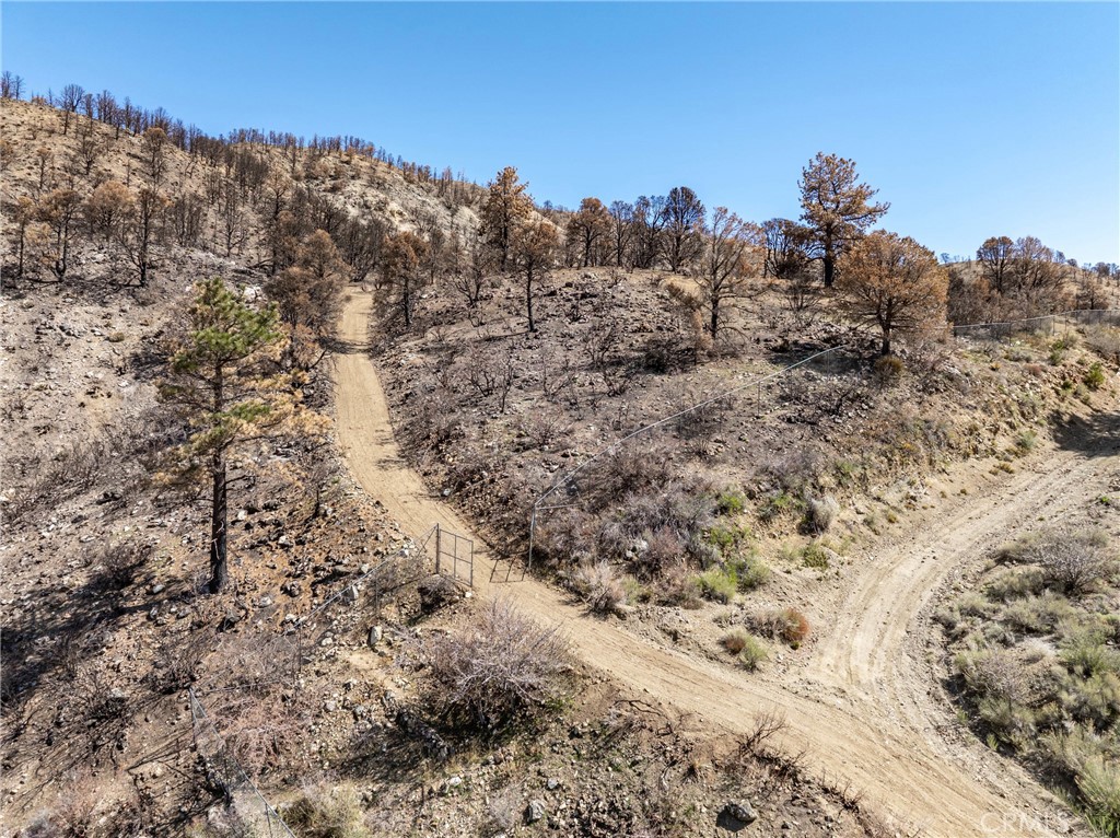 0 North Cardinal Road Wrightwood, CA 92397 - Photo 8 of 22 a view of a dry field covered with snow in the background