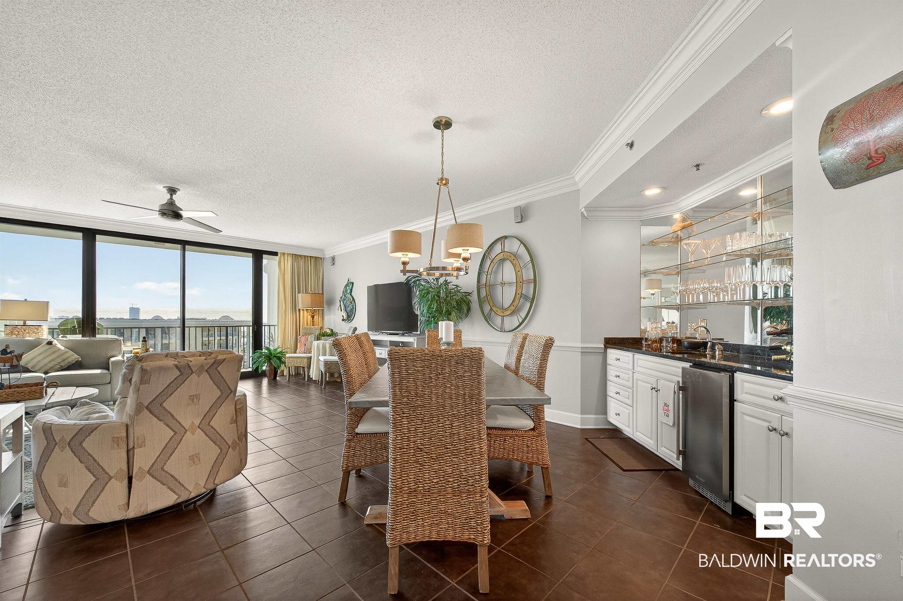 27582 Canal Road, Unit 2507 Orange Beach, AL 36561 - Photo 20 of 75 Dining room with expansive windows, a textured ceiling, ornamental molding, a ceiling fan, and dark tile patterned flooring