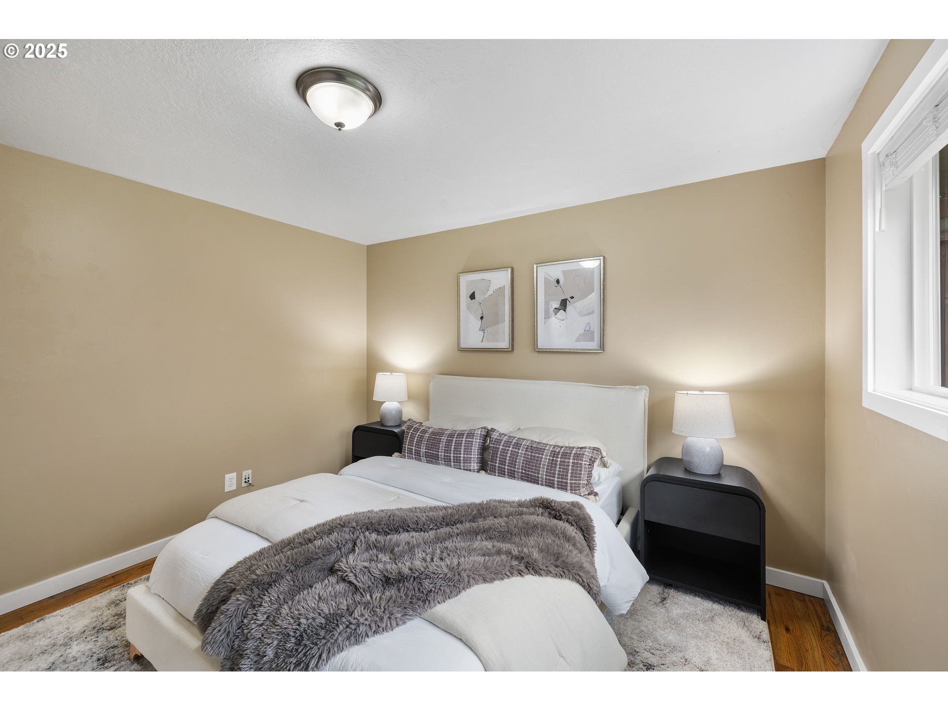 7402 Southwest Locust Street Portland, OR 97223 - Photo 13 of 25 a bedroom with a bed and a window