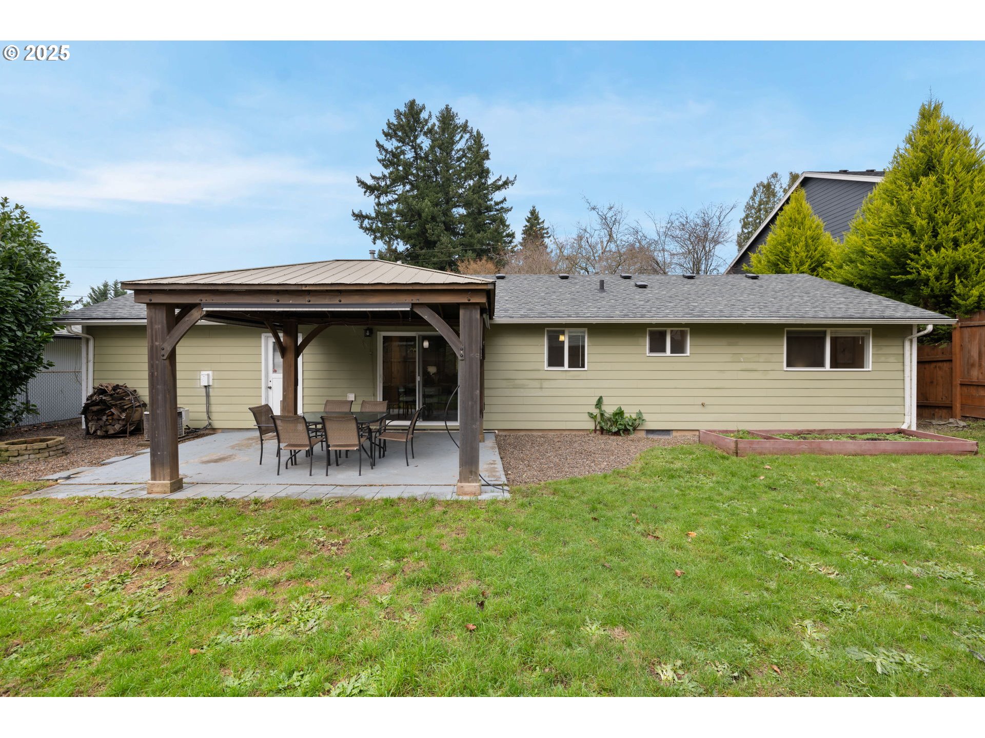 7402 Southwest Locust Street Portland, OR 97223 - Photo 22 of 25 a view of house with backyard and seating area