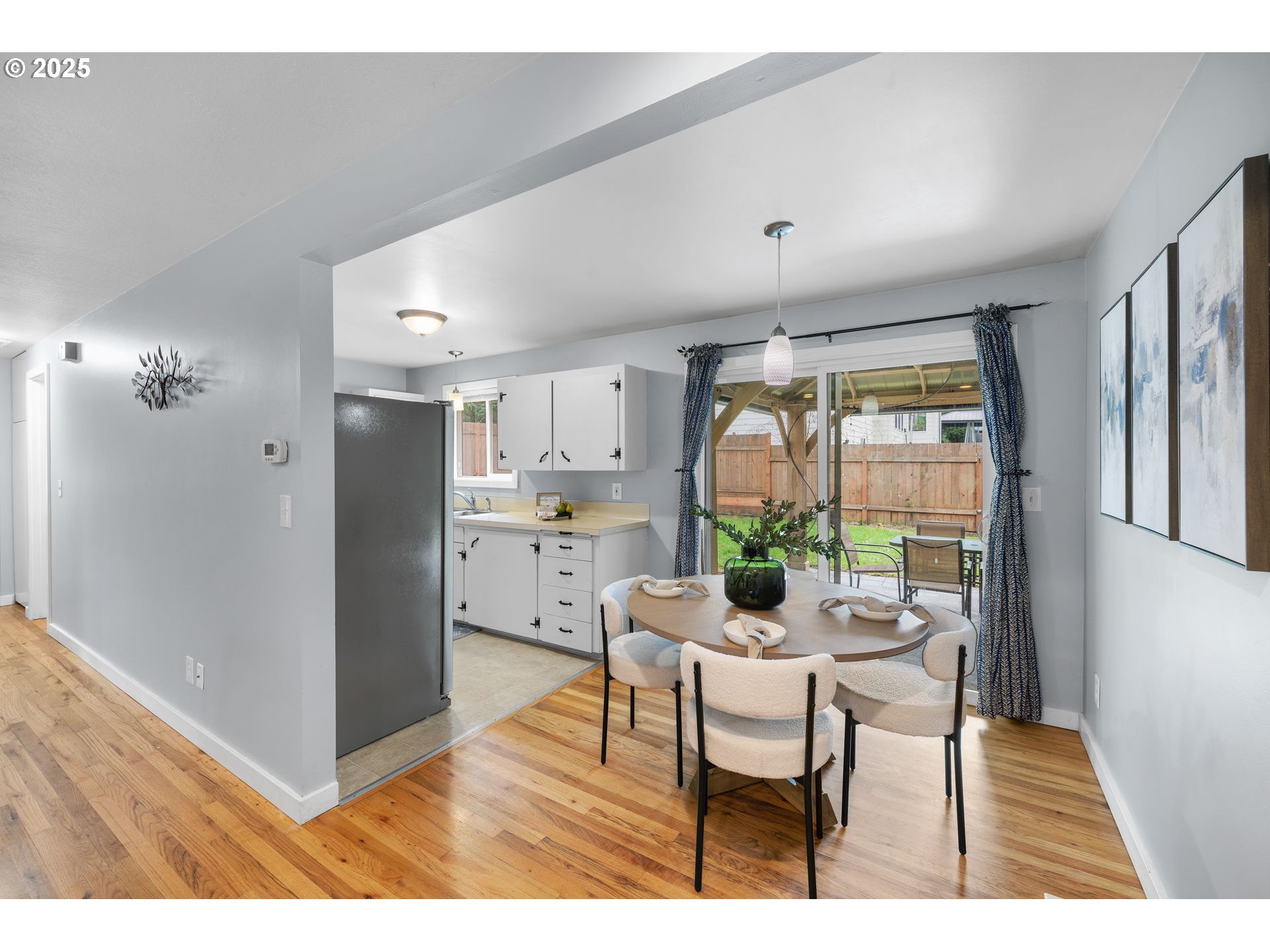 7402 Southwest Locust Street Portland, OR 97223 - Photo 8 of 25 a living room with furniture and a large window