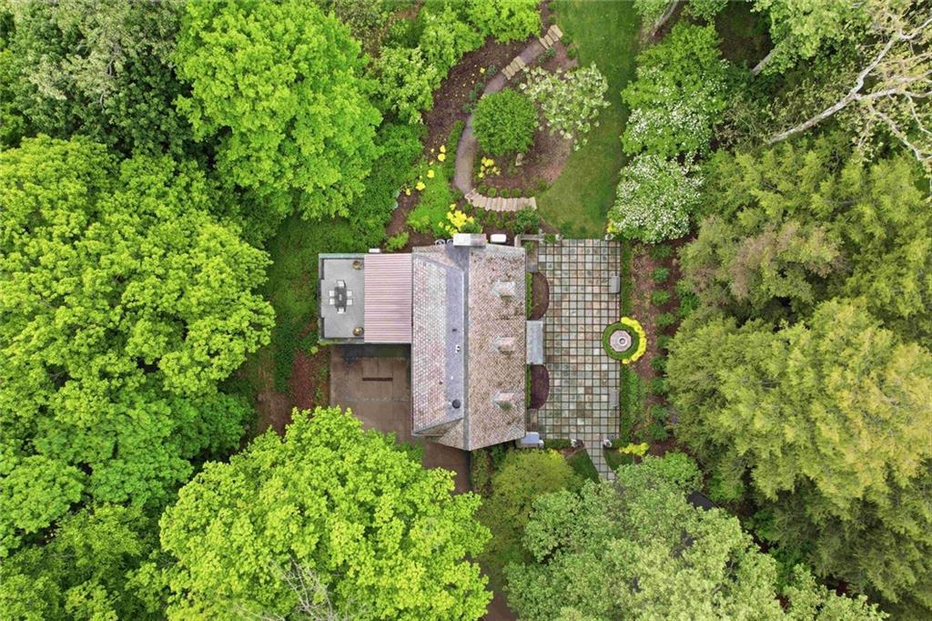 810 Persimmon Road Sewickley, PA 15143 - Photo 49 of 49 An aerial view reveals the full scope of the property — the slate-roofed residence, great bluestone courtyard, rear terrace, level lawn, and the extraordinary wooded canopy.