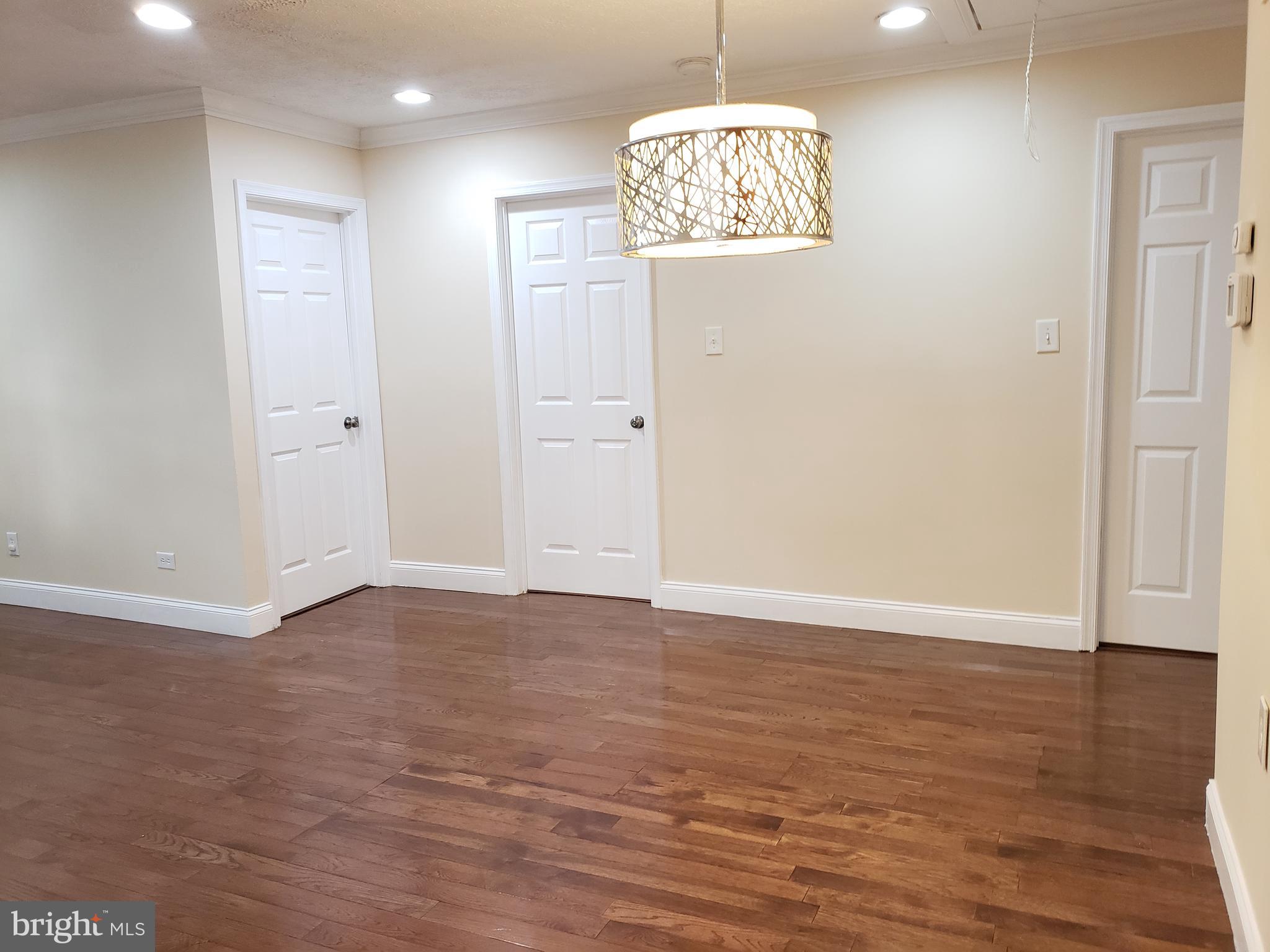 7737 Normandy Road Landover, MD 20785 - Photo 8 of 30 Dining Room Area with Gorgeous Light Fixture