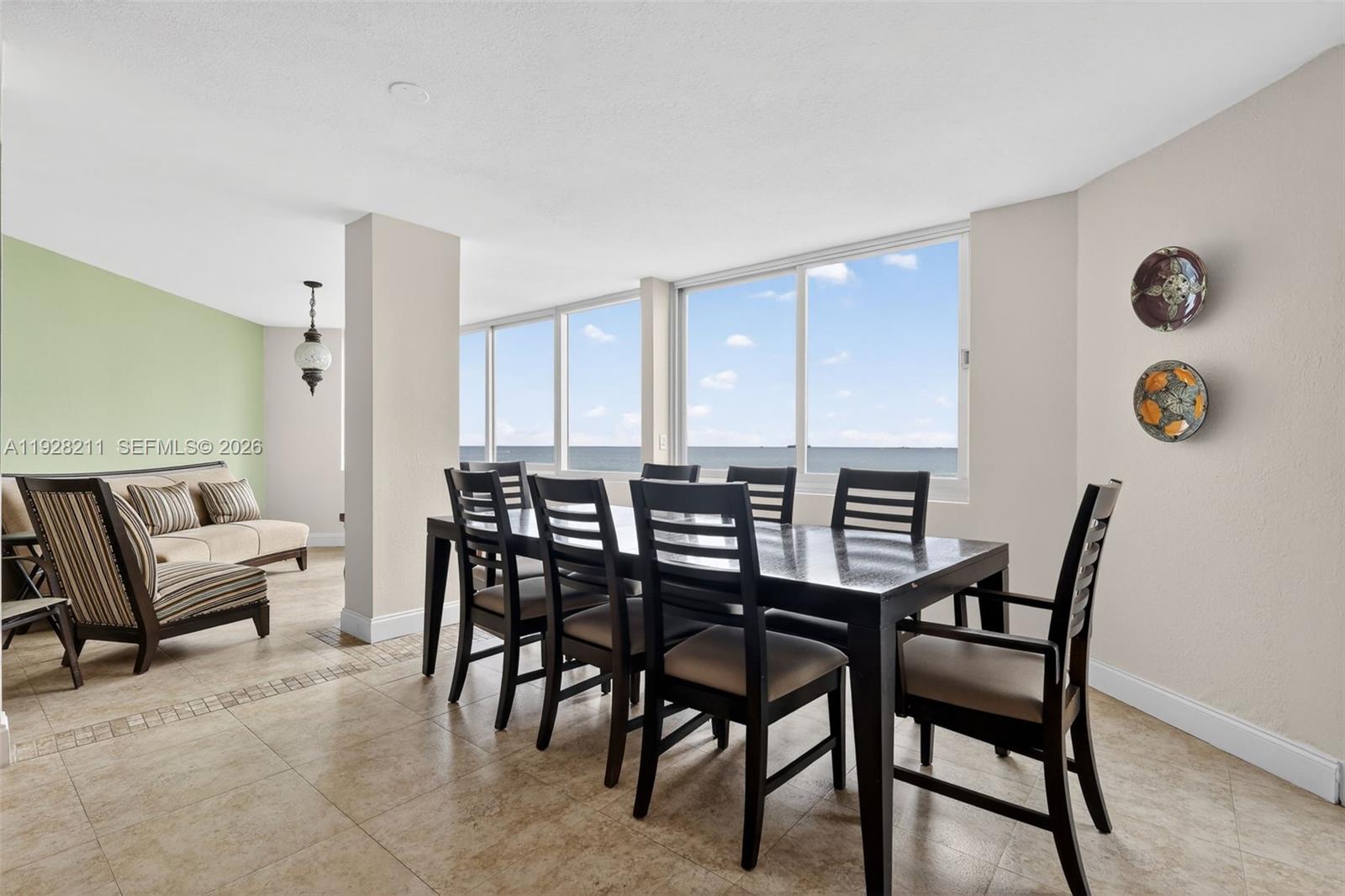 7135 Collins Avenue, Unit 1015 Miami Beach, FL 33141 - Photo 13 of 41 a view of a dining room with furniture and a window