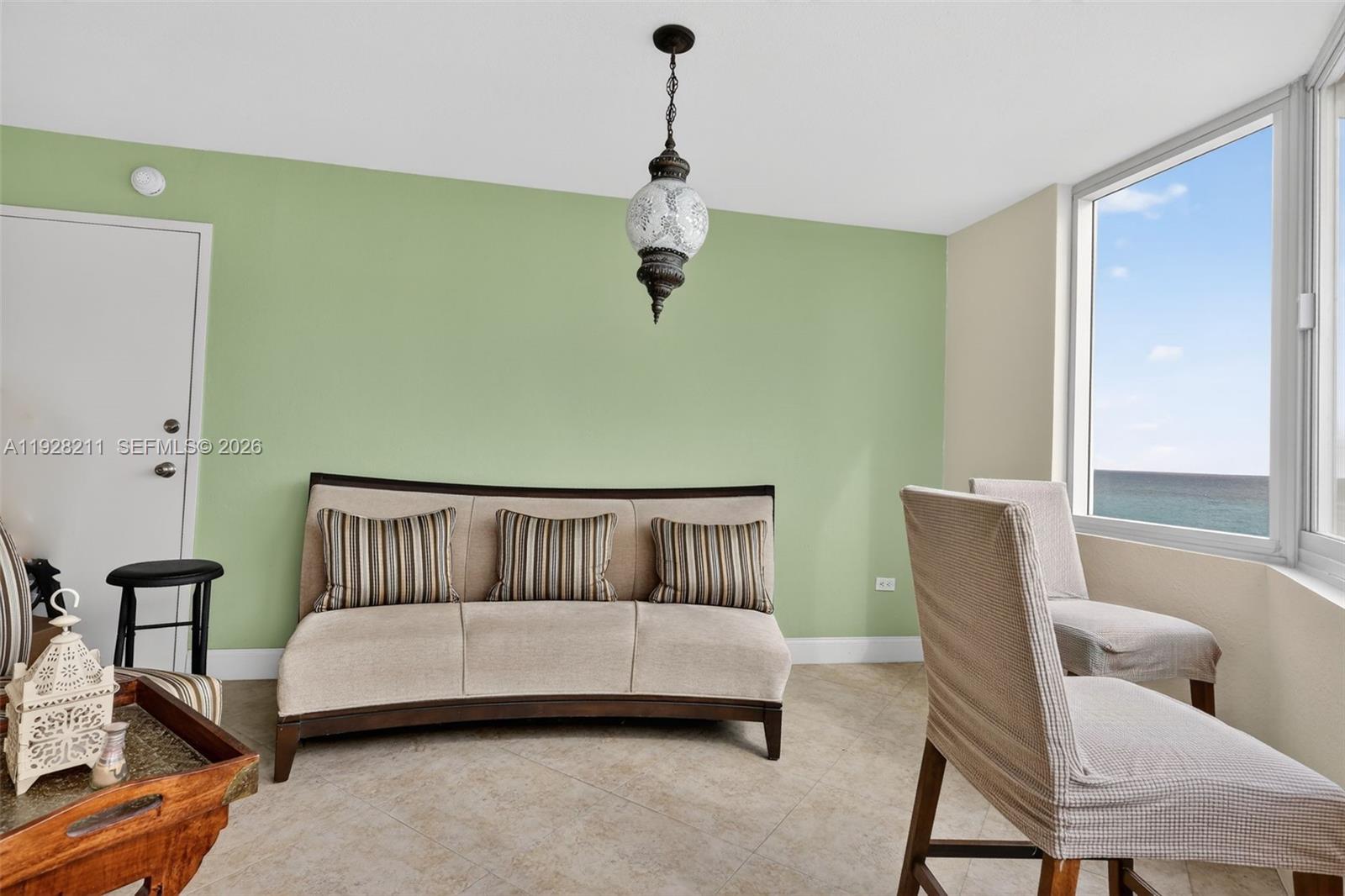 7135 Collins Avenue, Unit 1015 Miami Beach, FL 33141 - Photo 14 of 41 a living room with furniture