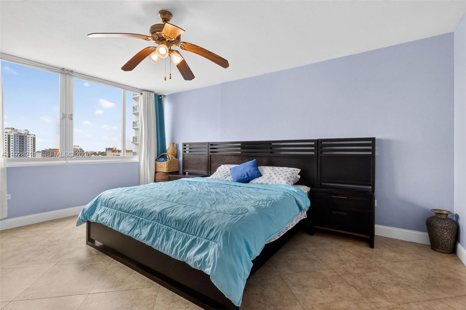 7135 Collins Avenue, Unit 1015 Miami Beach, FL 33141 - Photo 19 of 41 a bedroom with a bed and window