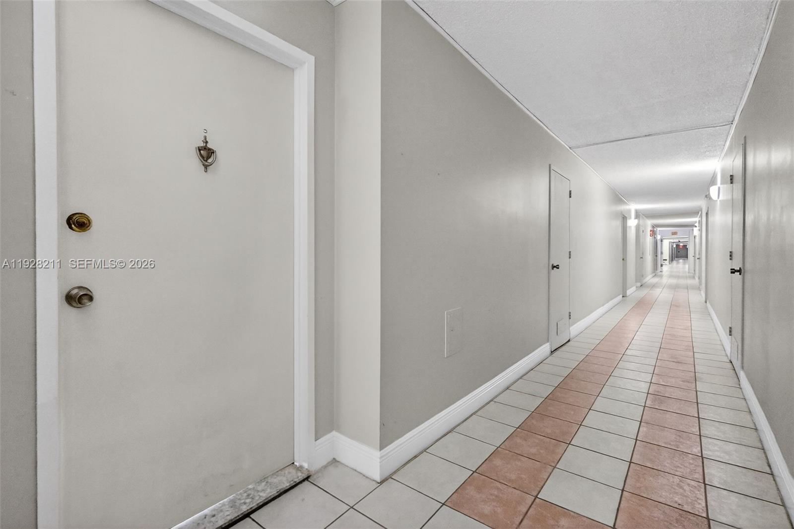 7135 Collins Avenue, Unit 1015 Miami Beach, FL 33141 - Photo 3 of 41 a view of a hallway