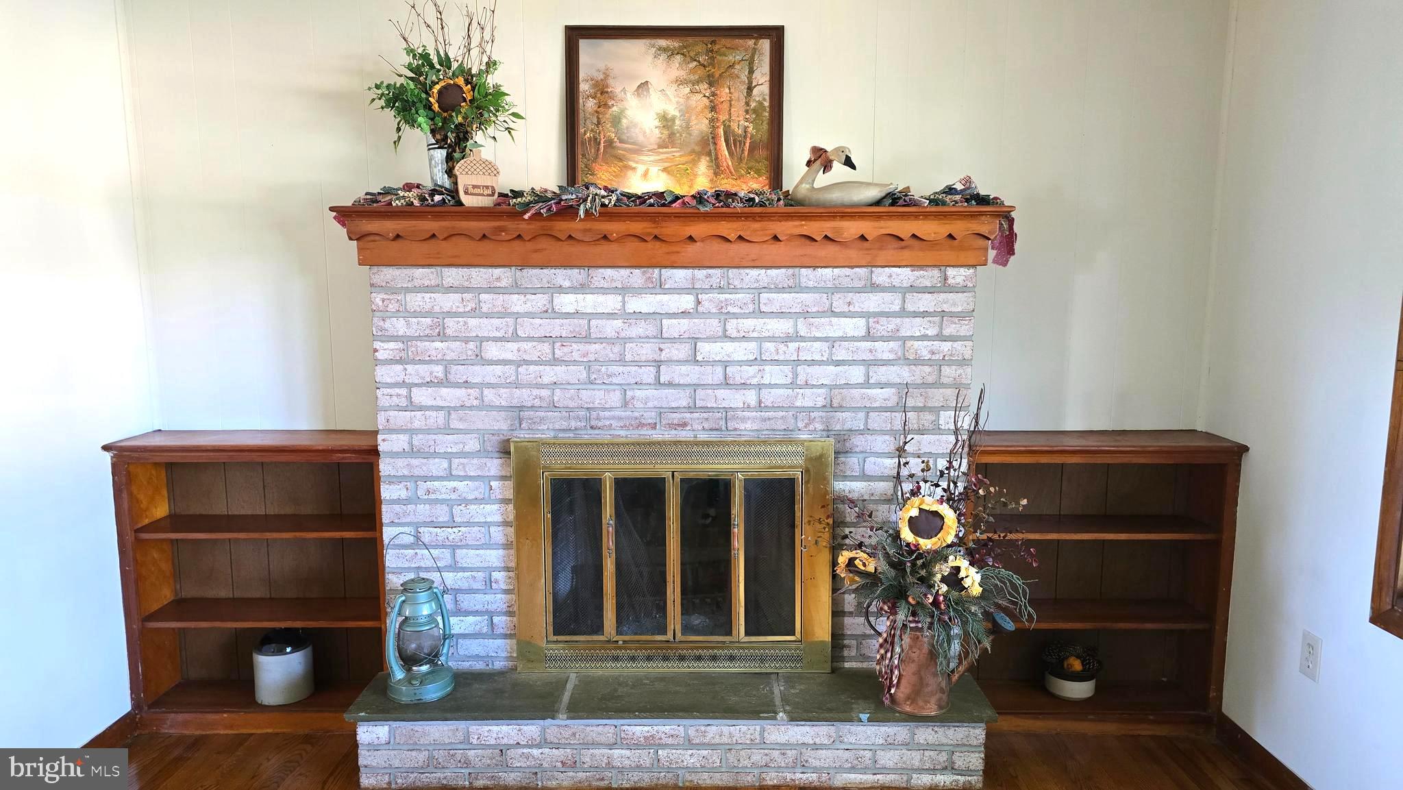 1734 Becker Road Manheim, PA 17545 - Photo 14 of 30 a front view of a fireplace with black door