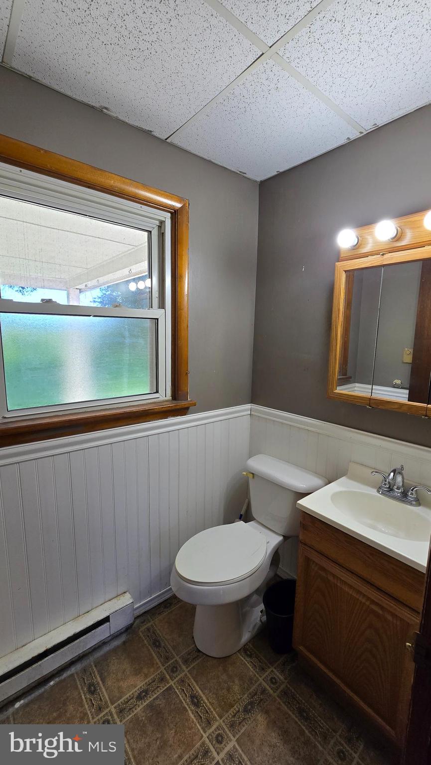 1734 Becker Road Manheim, PA 17545 - Photo 18 of 30 a bathroom with a toilet sink and mirror