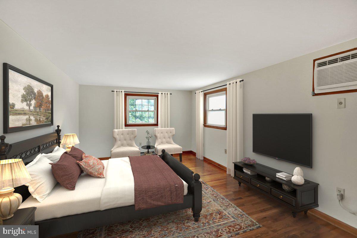 1734 Becker Road Manheim, PA 17545 - Photo 19 of 30 a bedroom with a bed and a flat screen tv