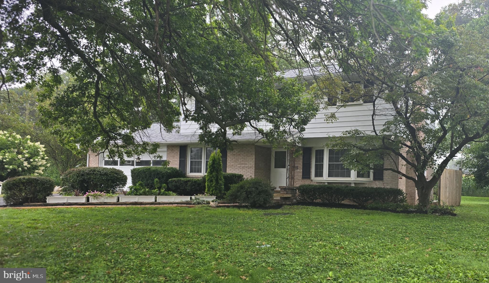 1734 Becker Road Manheim, PA 17545 - Photo 2 of 30 a front view of a house with garden