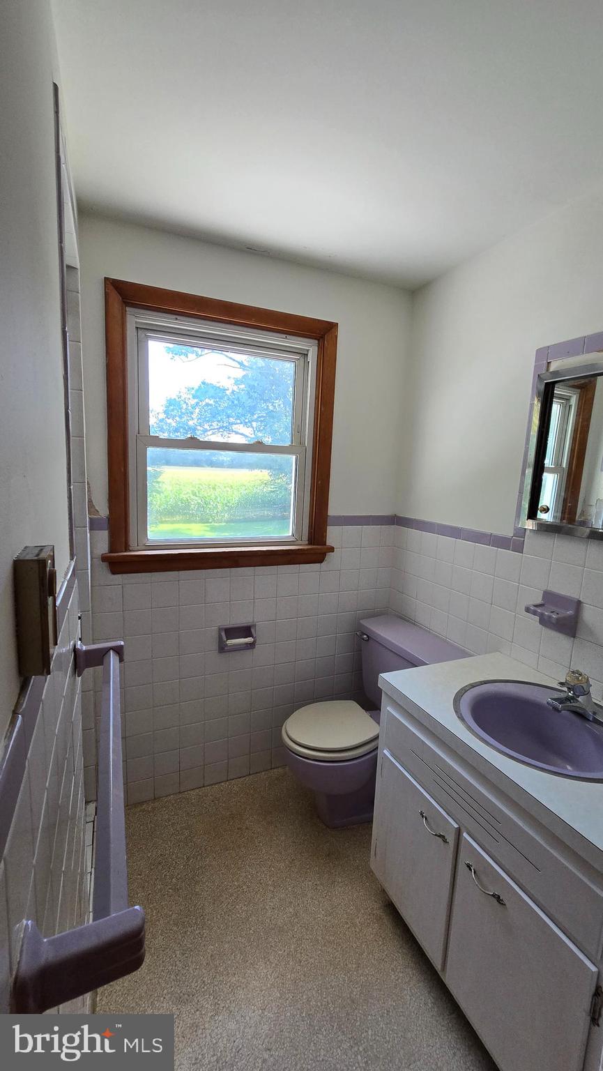 1734 Becker Road Manheim, PA 17545 - Photo 21 of 30 a bathroom with a toilet sink and window