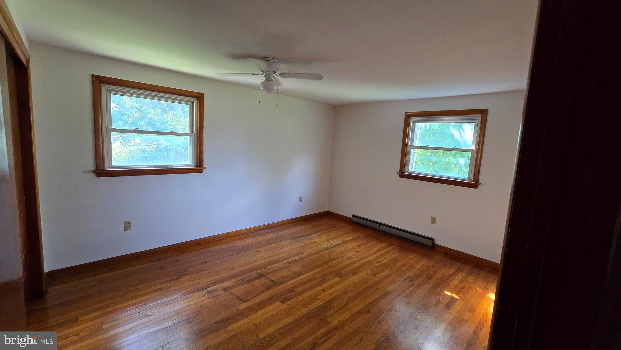 1734 Becker Road Manheim, PA 17545 - Photo 23 of 30 a view of an empty room with wooden floor and a window