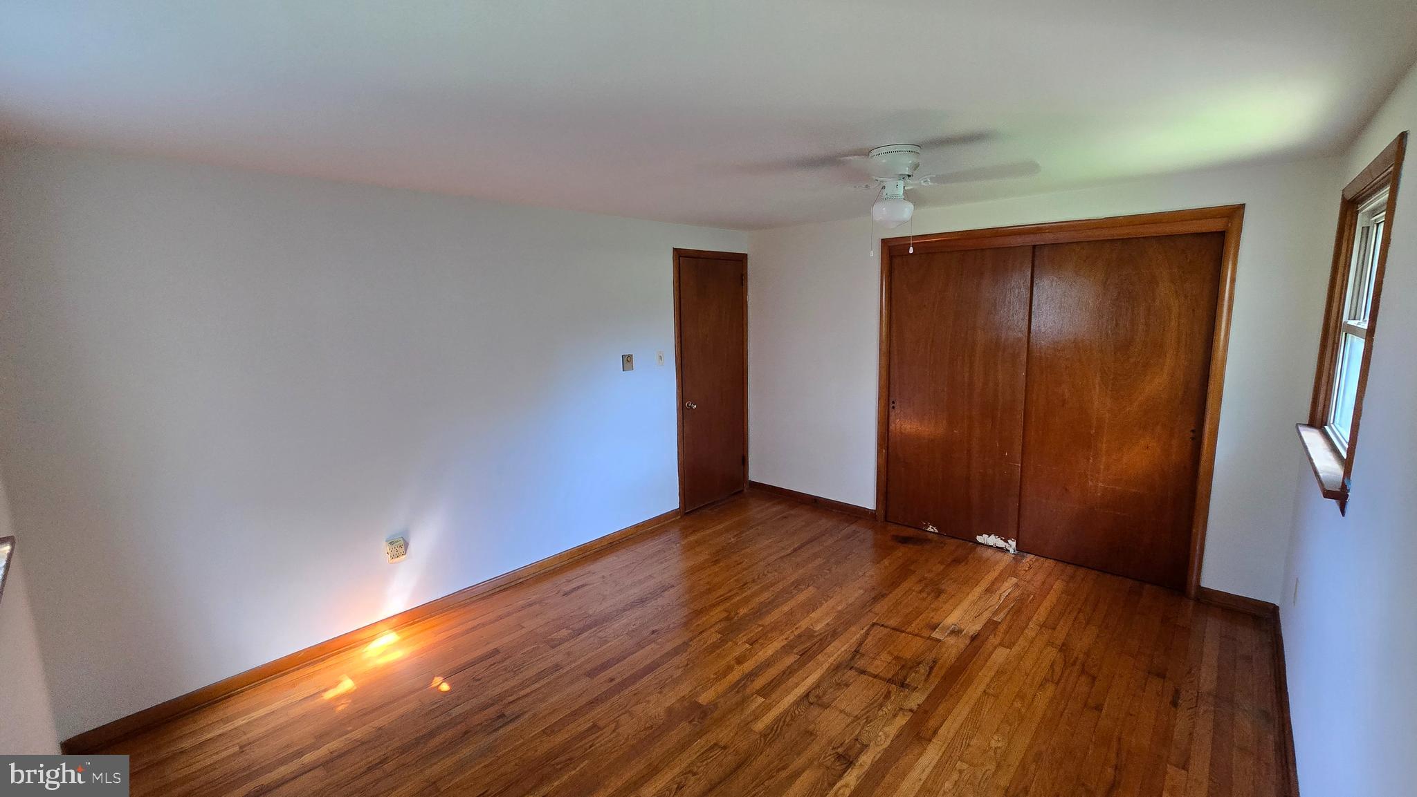 1734 Becker Road Manheim, PA 17545 - Photo 24 of 30 a view of an empty room with closet and wooden floor