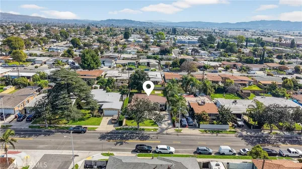 an aerial view of residential houses with outdoor space