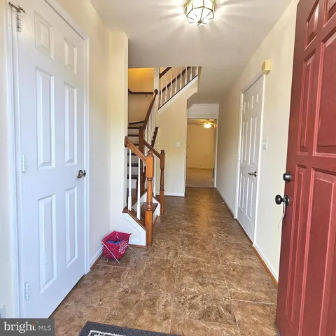 a view of a gallery with wooden floor