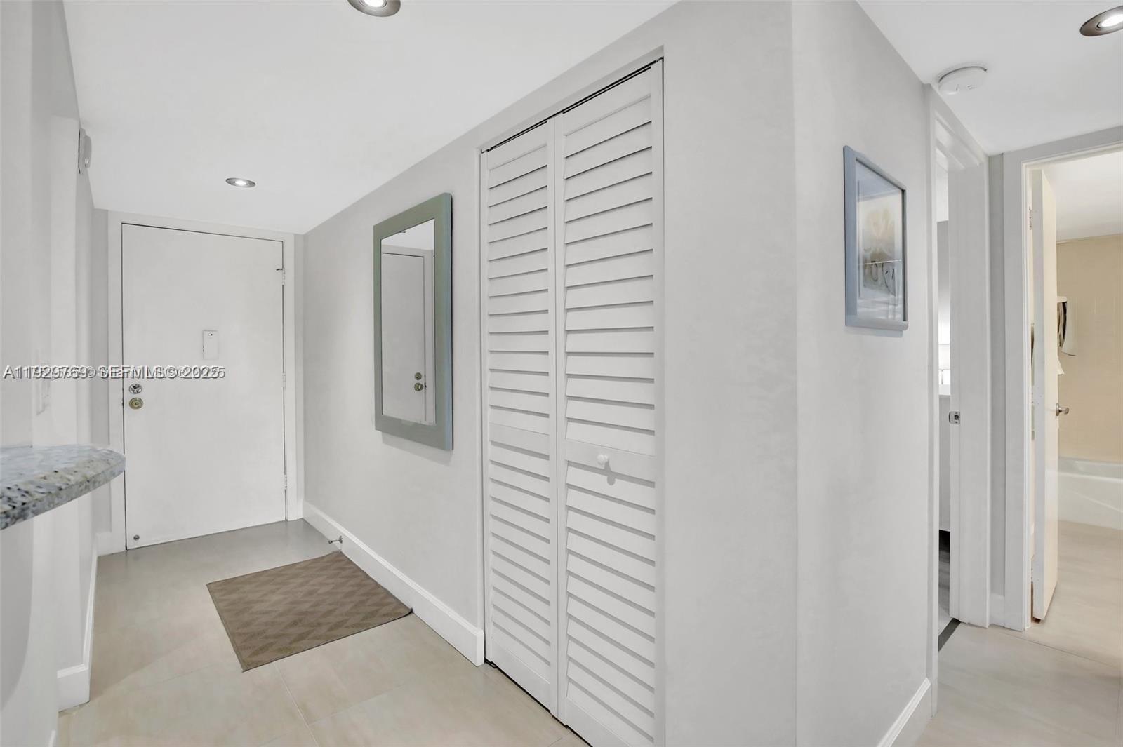 3930 Inverrary Boulevard, Unit 405D Lauderhill, FL 33319 - Photo 25 of 46 a view of hallway with walk in closet