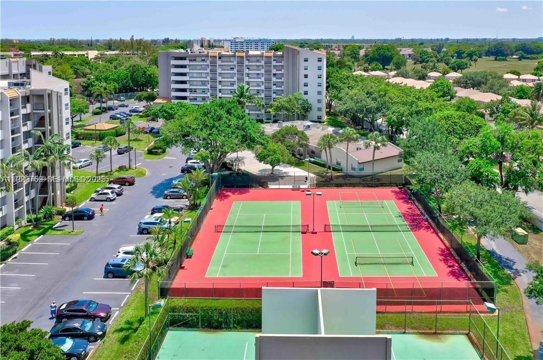 3930 Inverrary Boulevard, Unit 405D Lauderhill, FL 33319 - Photo 37 of 46 a view of a multi story building with a yard