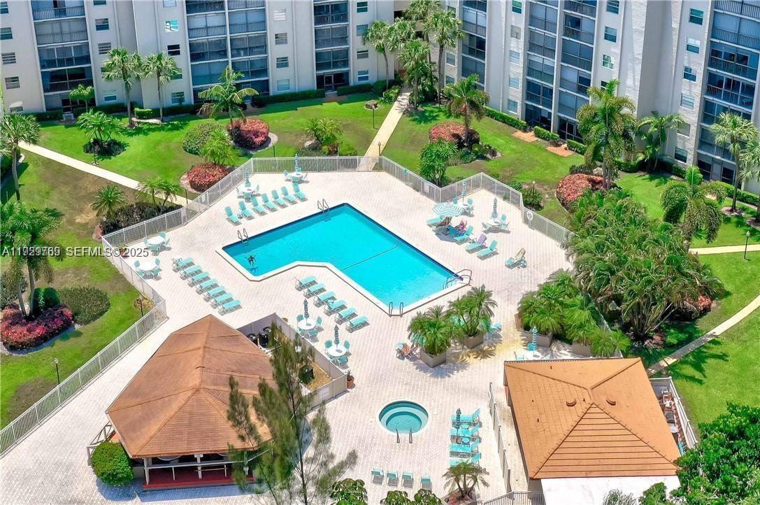 3930 Inverrary Boulevard, Unit 405D Lauderhill, FL 33319 - Photo 39 of 46 an aerial view of a house with a garden and swimming pool