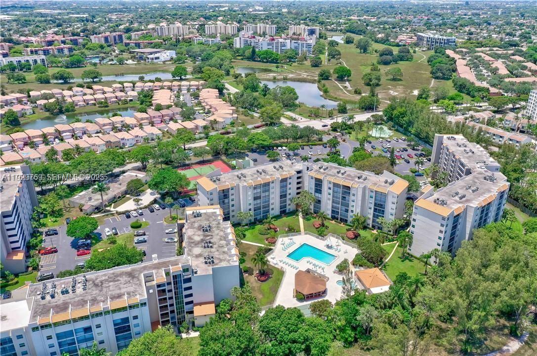 3930 Inverrary Boulevard, Unit 405D Lauderhill, FL 33319 - Photo 40 of 46 an aerial view of a house with a yard and lake view
