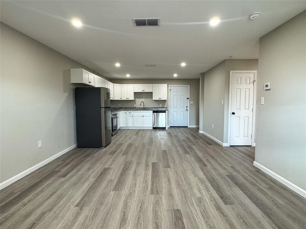 216 Smith Circle, Unit 1 Point, TX 75472 - Photo 7 of 15 a view of kitchen appliances wooden floor and staircase