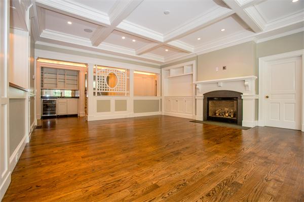 22 Wachusett Road Wellesley, MA 02481 - Photo 12 of 29 a view of empty room with wooden floor and fireplace