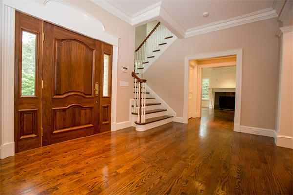 22 Wachusett Road Wellesley, MA 02481 - Photo 4 of 29 a view of an entryway with wooden floor and staircase