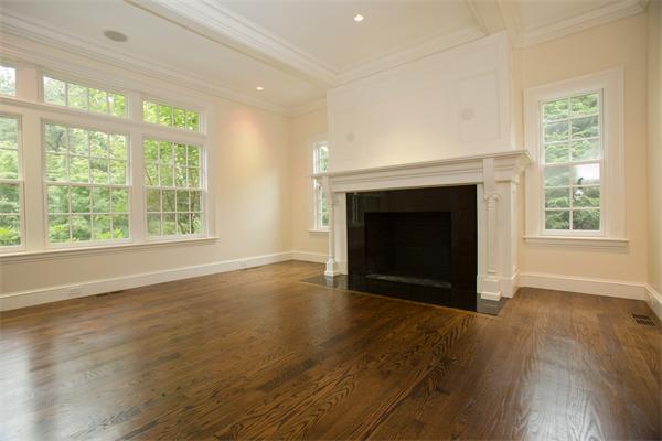 22 Wachusett Road Wellesley, MA 02481 - Photo 5 of 29 an empty room with wooden floor fireplace and windows