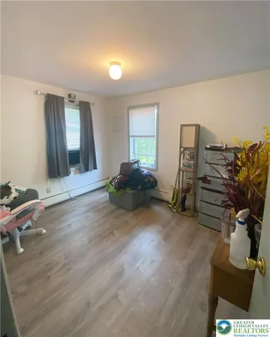 a livingroom with furniture and a flat screen tv