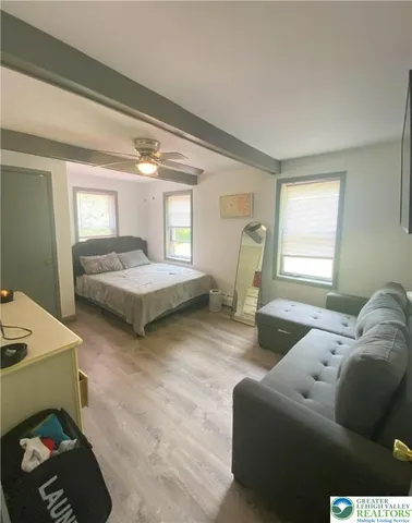 a living room with furniture and a window