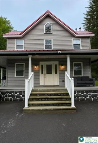 a front view of a house with a garage