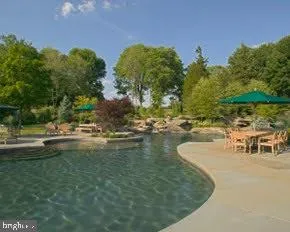 a living room filled with furniture and a flat screen tv