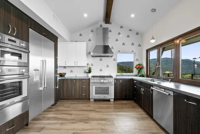 a bedroom with a large window and a bed