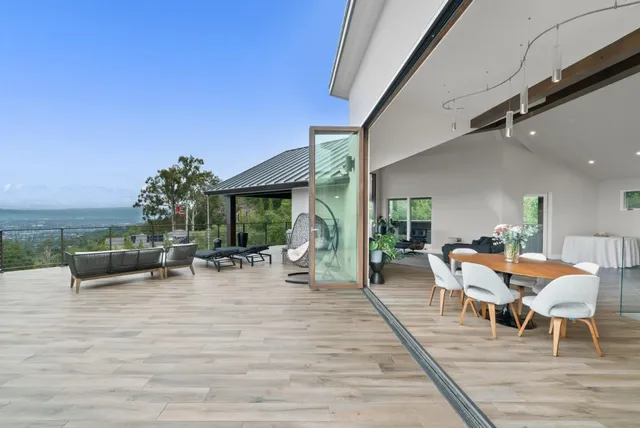 a view of a workspace with furniture and a gate