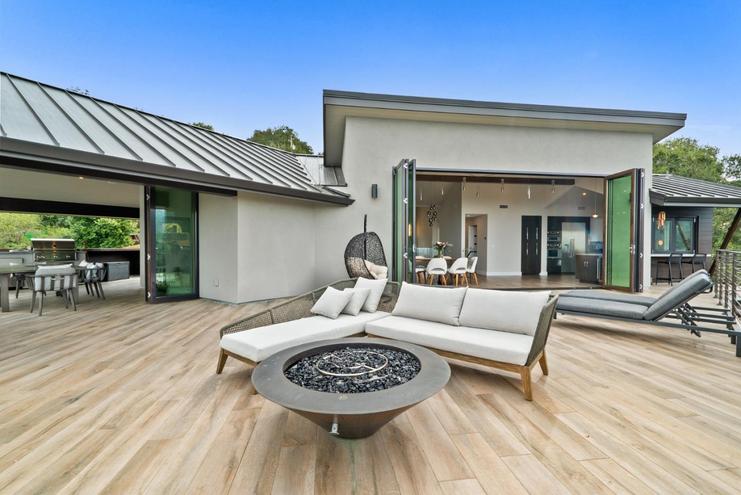 17808 Tourney Road Los Gatos, CA 95030 - Photo 44 of 111 a view of a patio with couches table and chairs with wooden floor