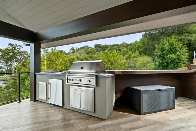 a view of balcony with wooden floor and fence
