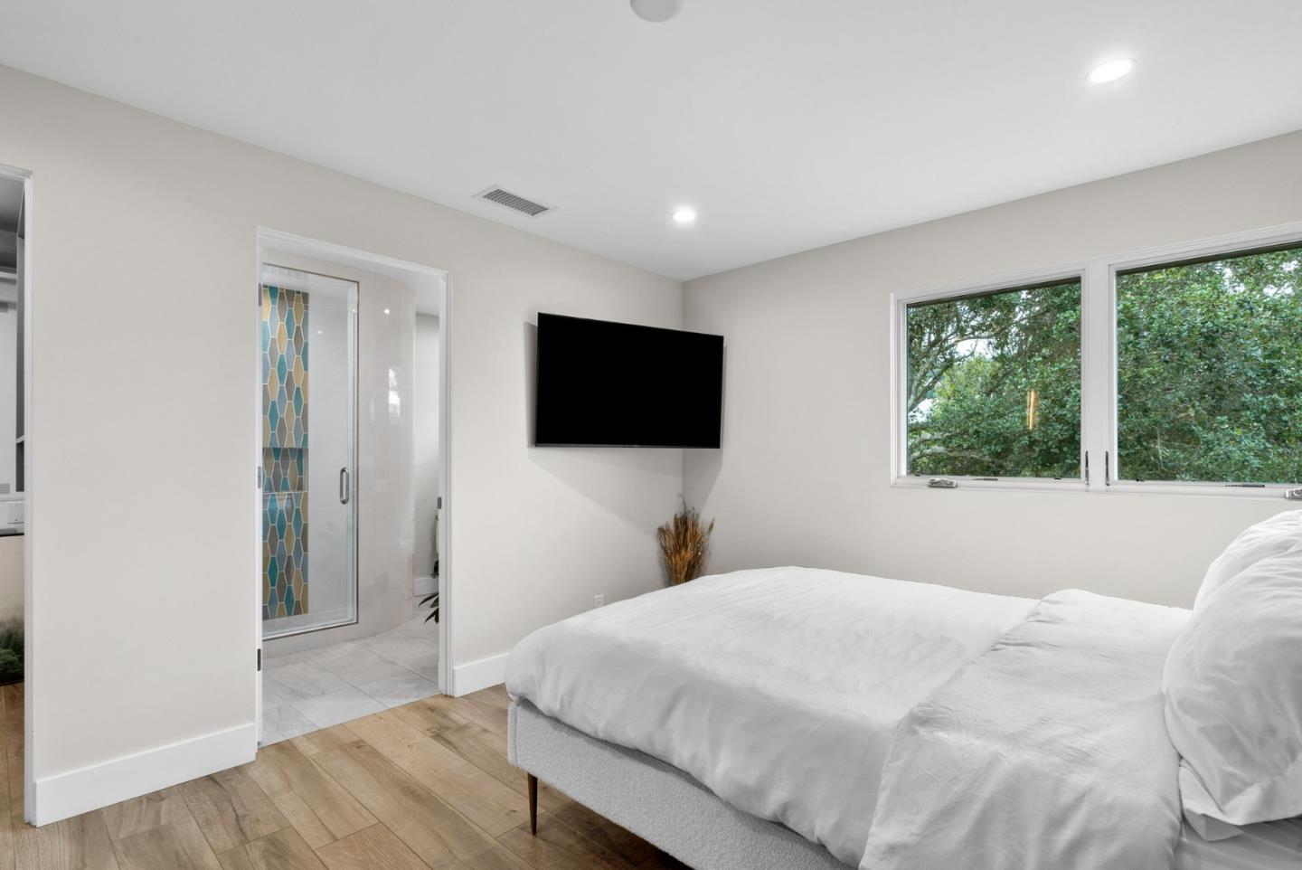 17808 Tourney Road Los Gatos, CA 95030 - Photo 53 of 111 a bedroom with a bed and a flat screen tv