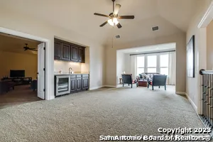 a living room with furniture and a window