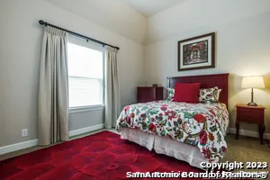 a living room with furniture and next to a window